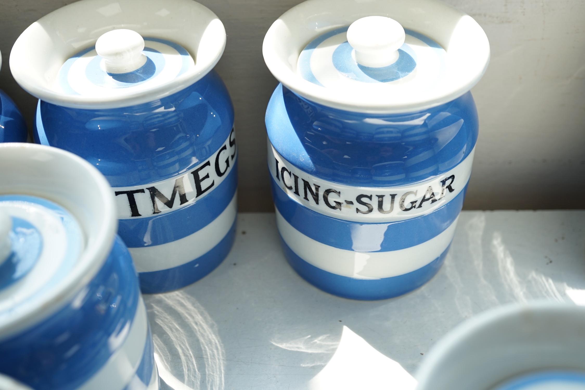 T.G.Green Cornish Kitchenware, eleven 9cm lidded storage jars to include Borax, Cayenne, Angelica, Turmeric, Ground-Ginger and Bay Leaves, Black Shield marks. Condition - poor, fair and good